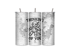 Three views of the Thinking of You insulated tumbler showing the wraparound distressed design, clear sliding lid, and reusable metal straw.