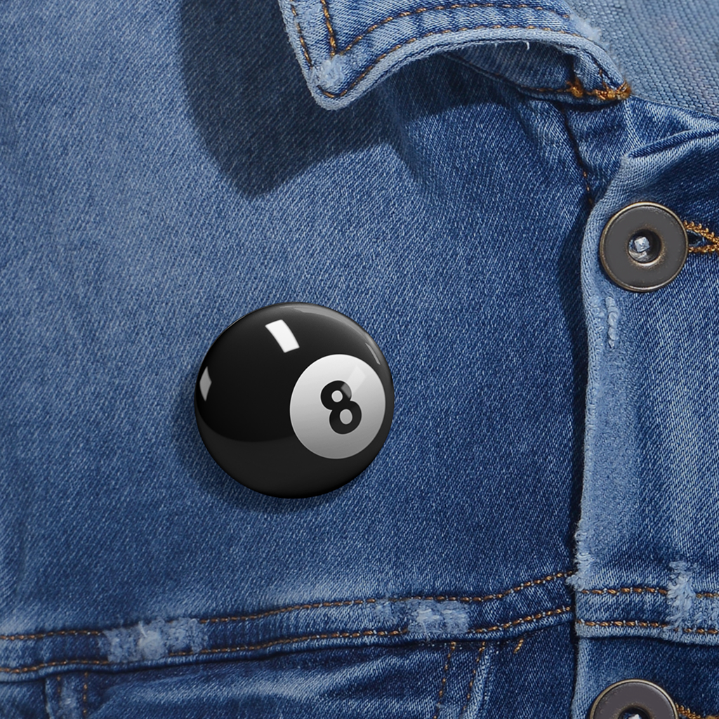 Glossy black 8-ball pinback button with silver clasp on a denim jacket, bold sarcastic design.