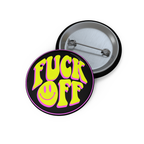 Neon yellow and pink “F*ck Off” pin with a twisted smiley face and black background, glossy finish and sharp edge.
